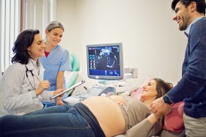 Doctor is screening pregnant woman in the hospital